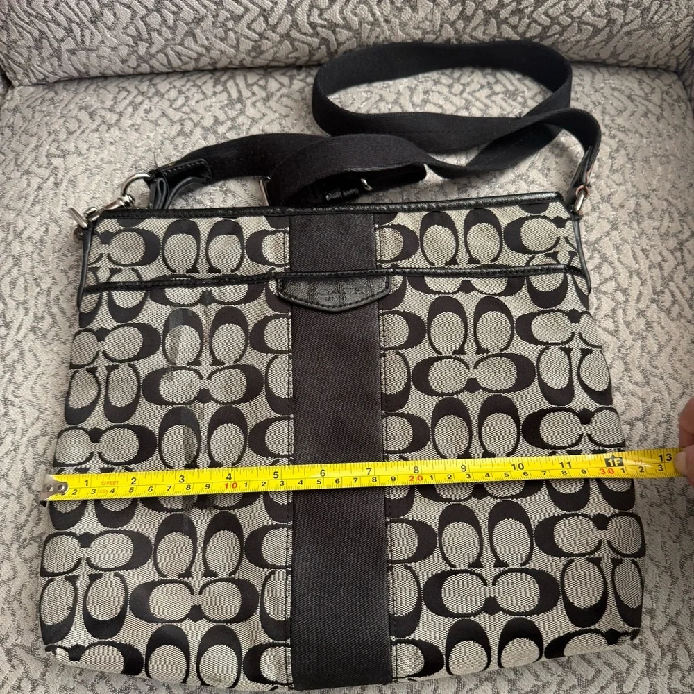 Coach Signature Stripe File Bag features a black and gray monogram canvas